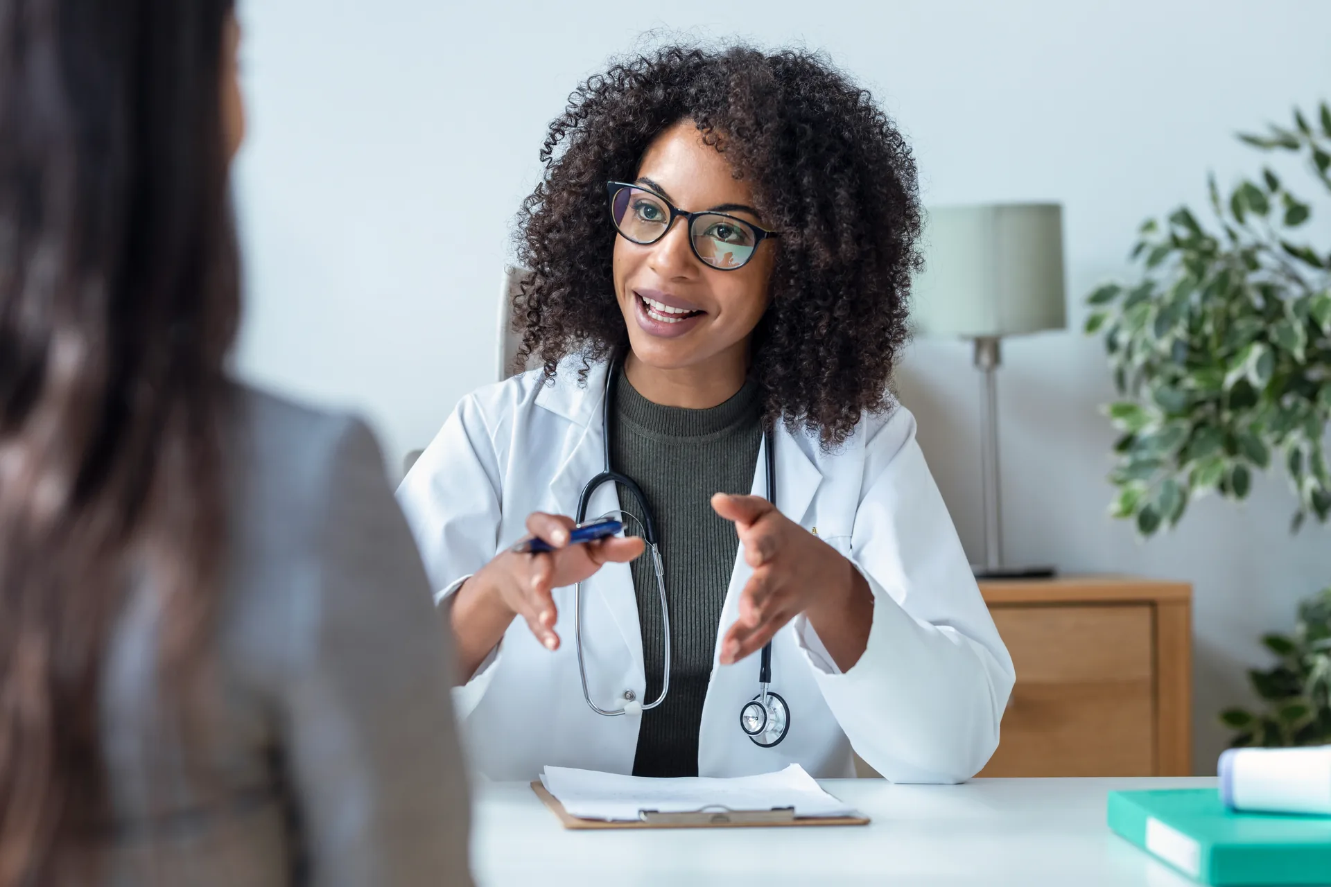 Provider discussing treatment with a patient